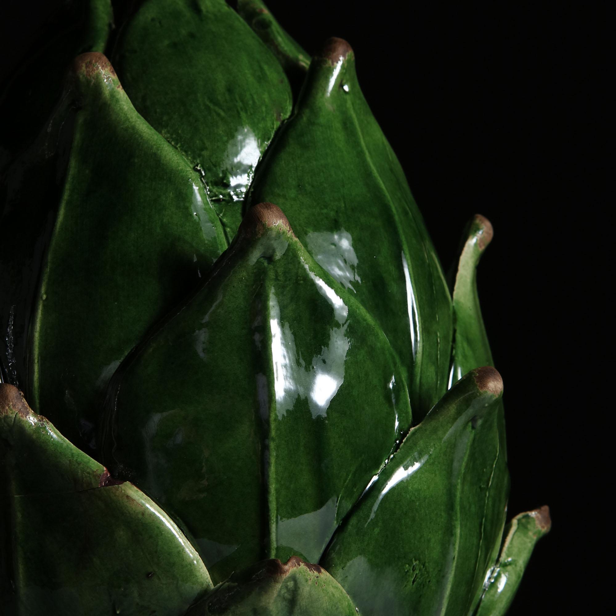 A matched pair of unusual ceramic table lamps modelled as artichokes, with layered leaves and rich green glaze, the artichokes supported on a circular base.

Please note: Lampshades not included.

Currently wired for the UK.

Measures: The