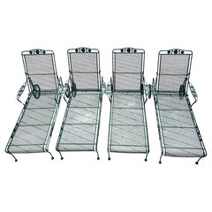 A Matching Set of Four Chantilly Rose Pattern Wrought Iron Chaise Lounges