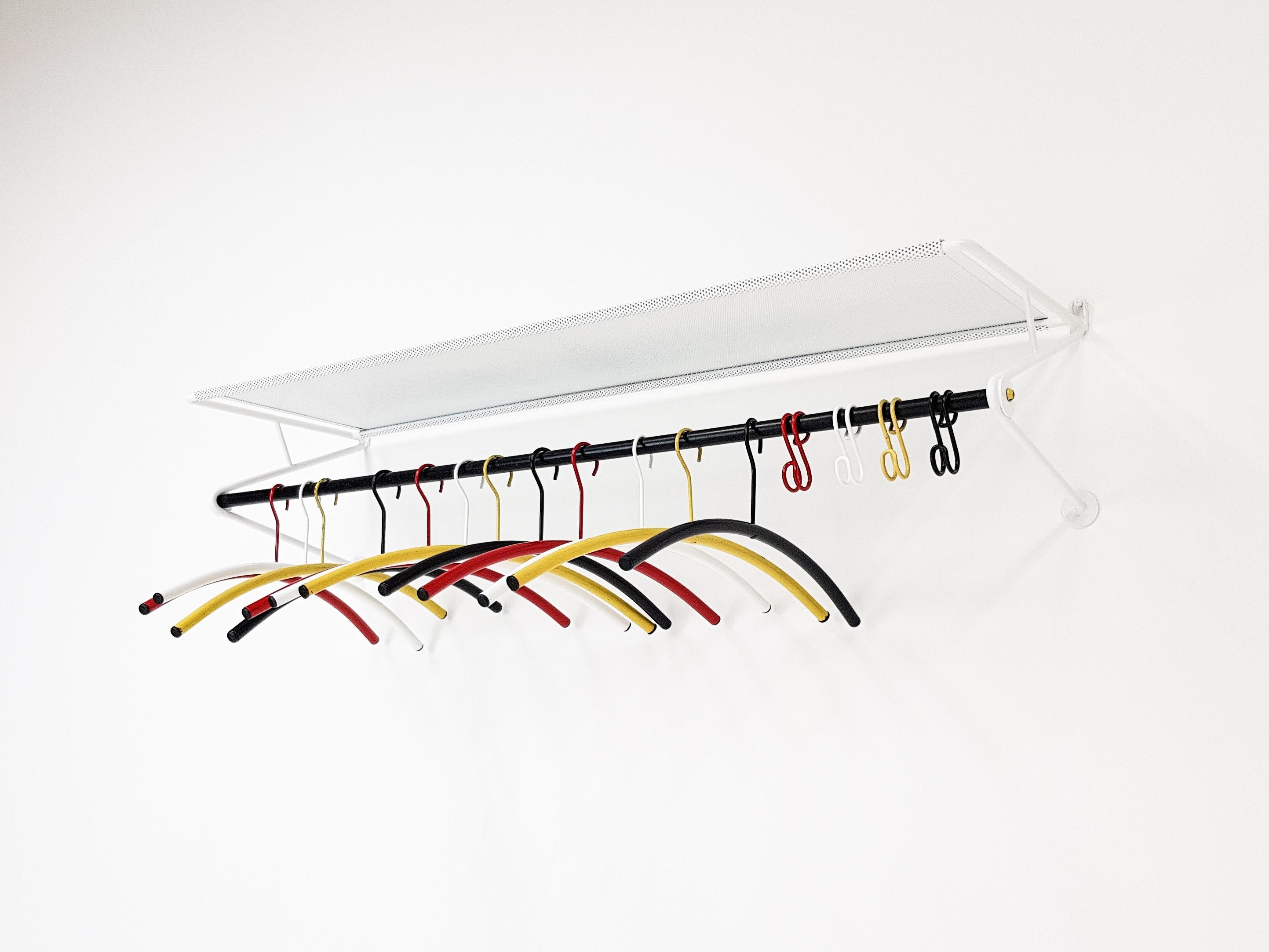 An ‘Ideaal’ Model 110 coat rack designed by Mathieu Matégot for Dutch company Artimeta Soest during the 1950s. The set retains all hooks and coat hangers and is the larger of the two sizes that were available.

This coat rack has a white frame,
