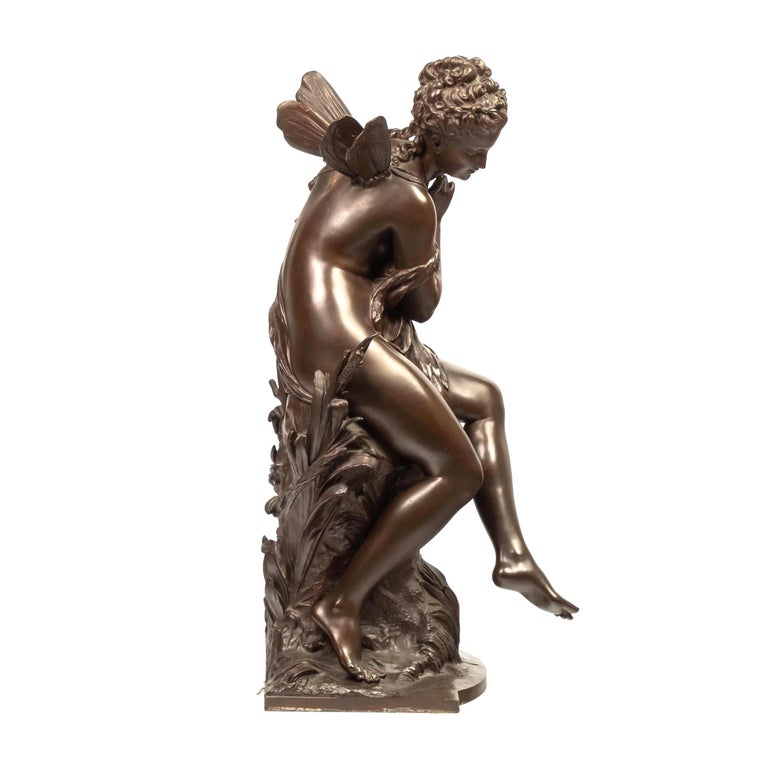 A fine quality Art Nouveau allegorical bronze sculpture depicting a seated fairy displaying small wings. Titled 