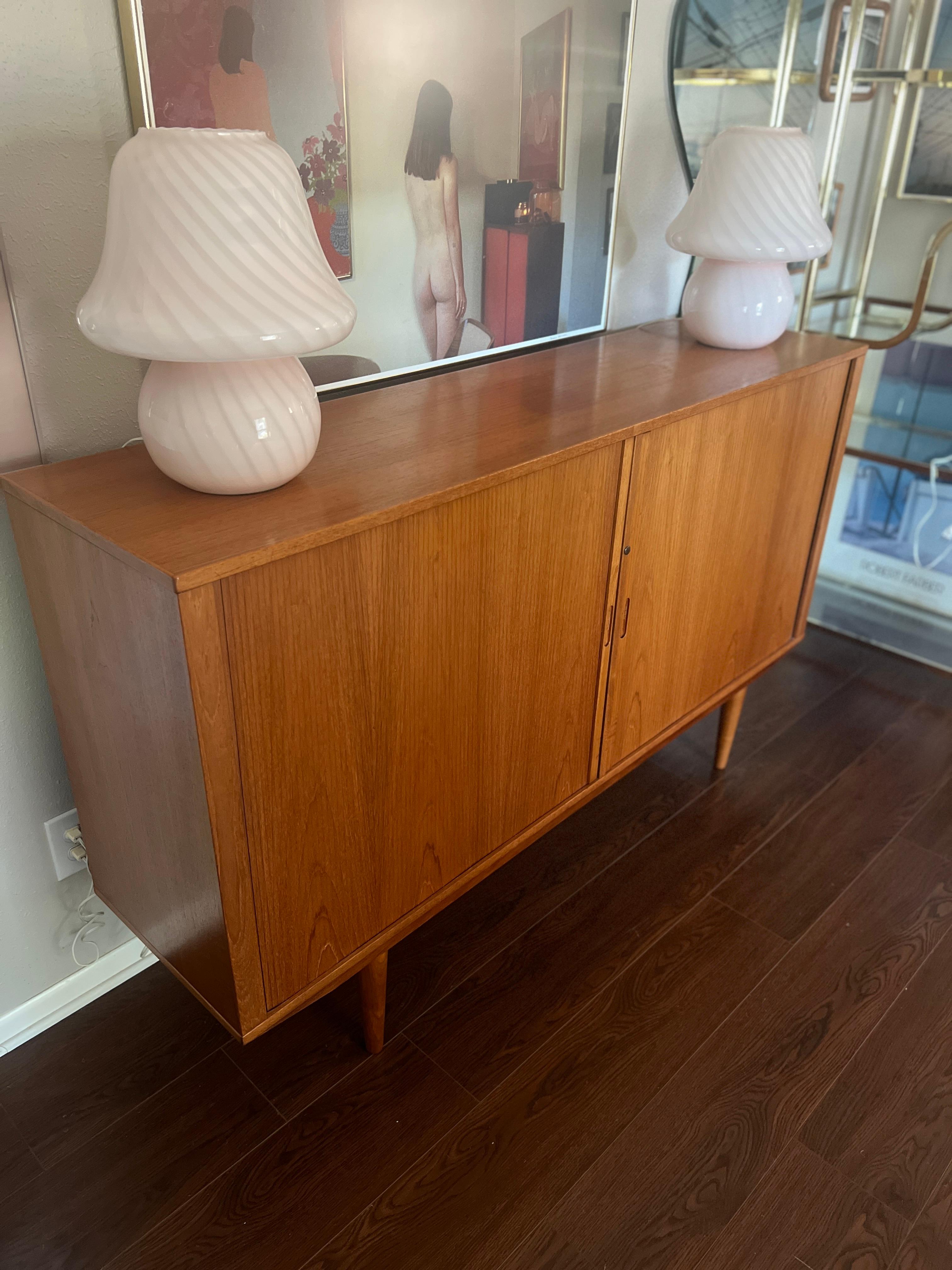 A MCM minimalist teak tall sideboard with tambour doors and tapered legs 3