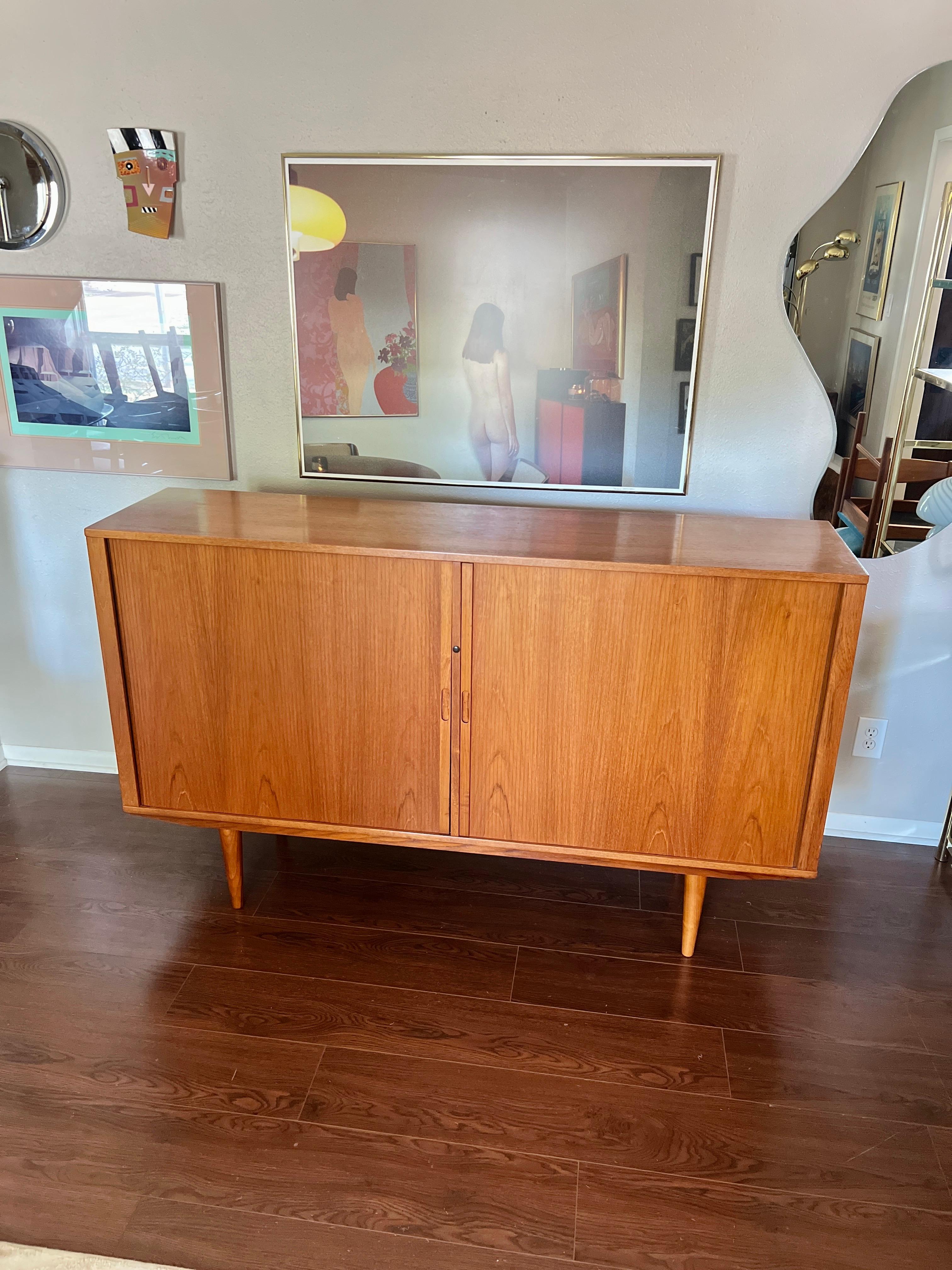 Mid-Century Modern A MCM minimalist teak tall sideboard with tambour doors and tapered legs