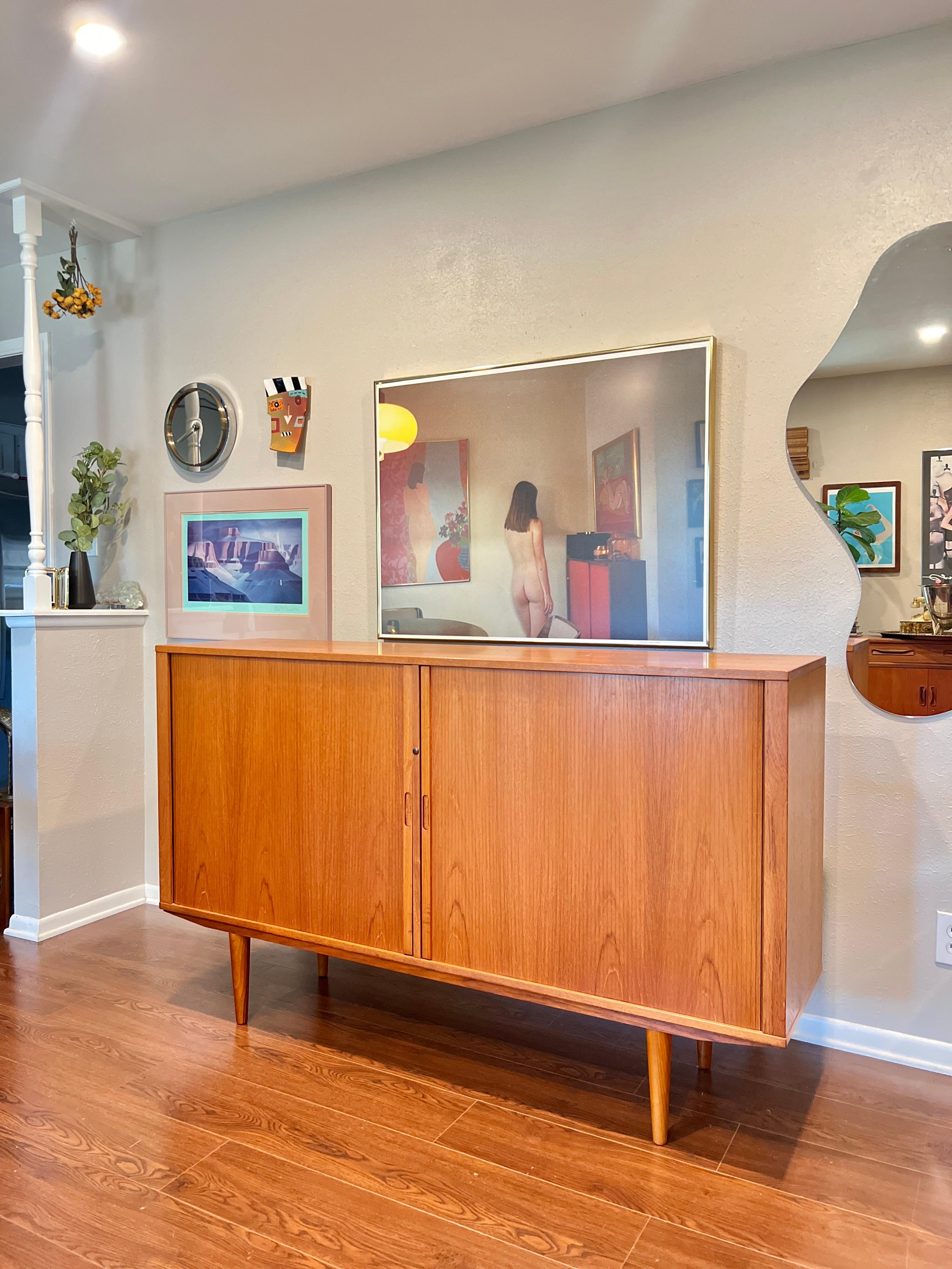 A MCM minimalist teak tall sideboard with tambour doors and tapered legs In Good Condition In Houston, TX
