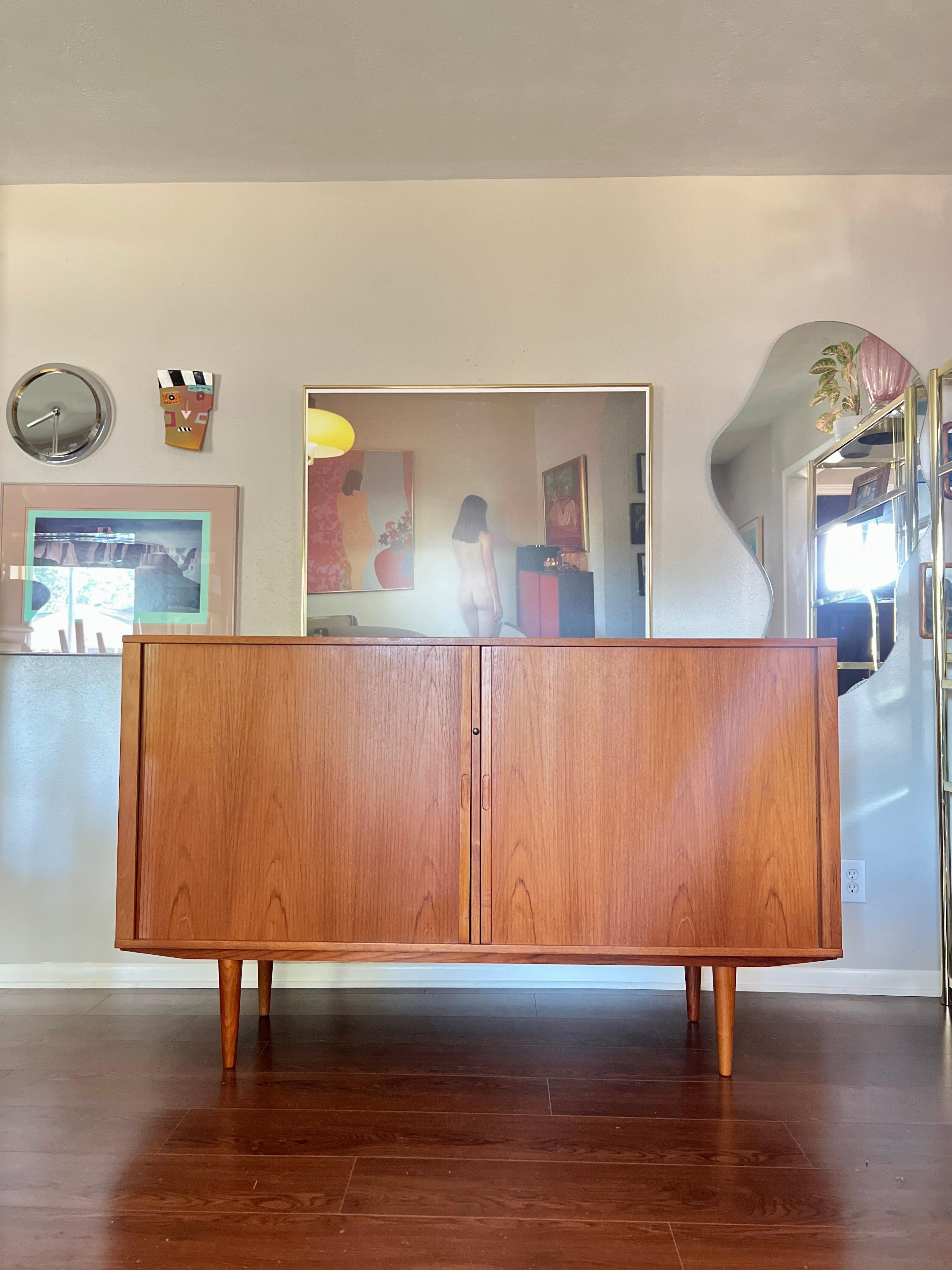 Late 20th Century A MCM minimalist teak tall sideboard with tambour doors and tapered legs