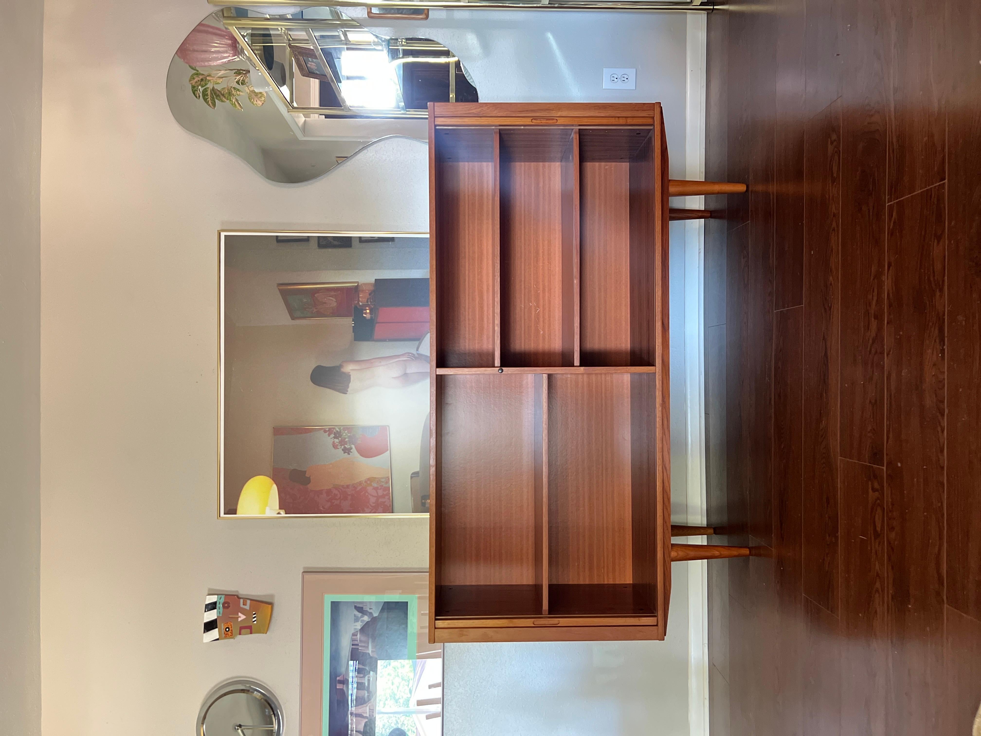 Teak A MCM minimalist teak tall sideboard with tambour doors and tapered legs