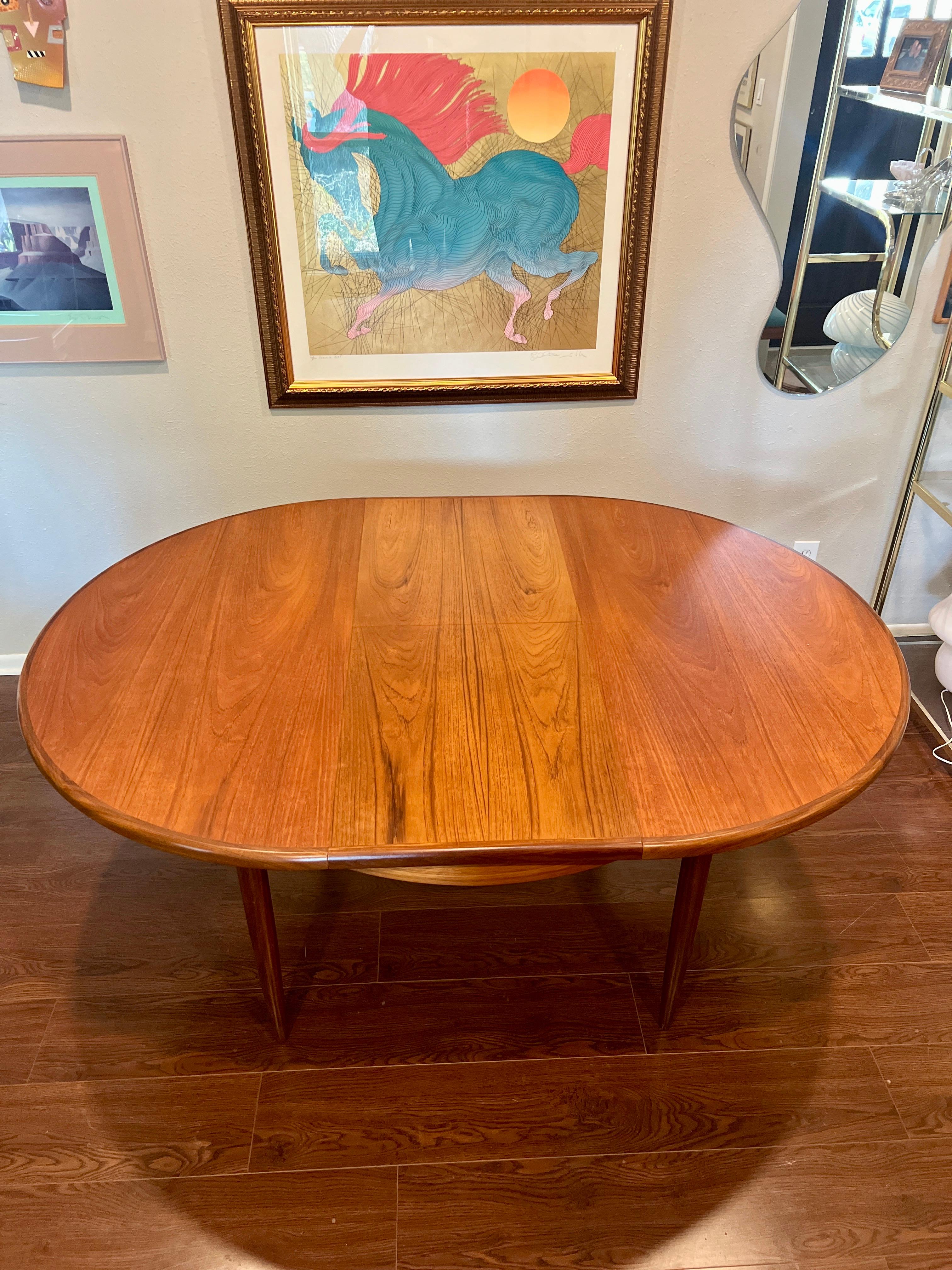 Mid-Century Modern A MCM round teak dining table by G plan, with one 18