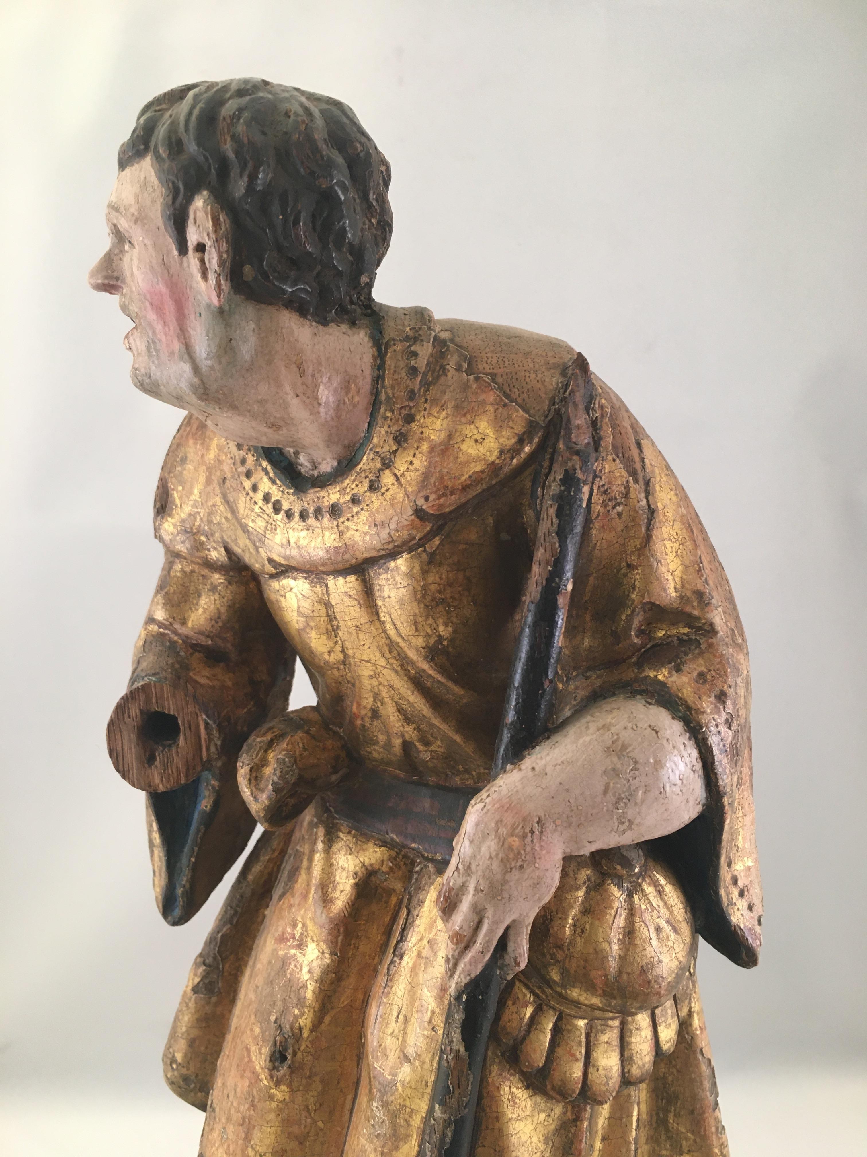 A polychromed wooden sculpture (a shepherd). Part of a retable piece - scene from the adoration of the shepherds.
Antwerp (Flanders) - early 16th century, and marked twice with the Antwerp hand (head and base).
Flattened at the back. The shepherd