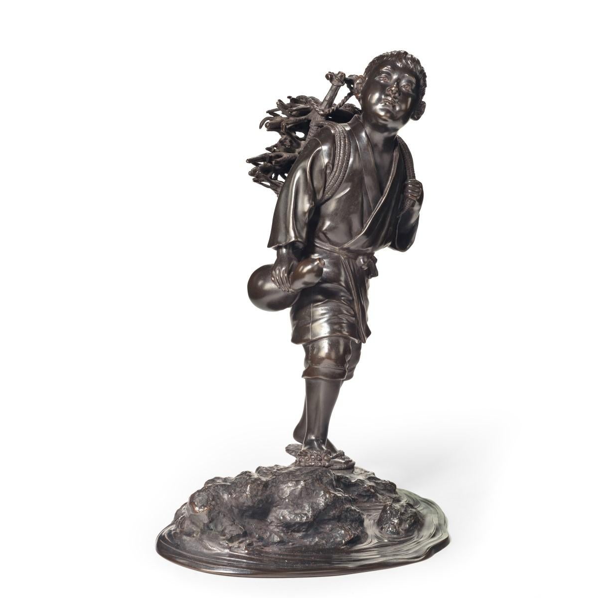 A Meiji period bronze of a boy carrying twigs, they are strapped onto his back on a carrying frame and he carries a gourd water bottle in his right hand, signed in a seal. Japanese, circa 1800.