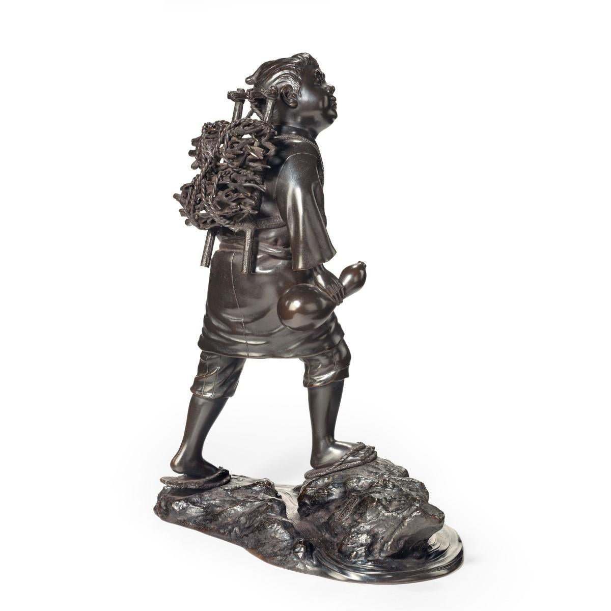 Japanese Meiji Period Bronze of a Boy Carrying Twigs For Sale