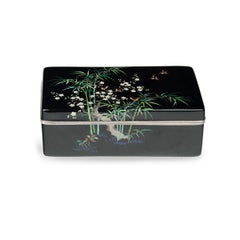 A Meiji period cloisonné box and cover with sparrows, prunus and bamboo