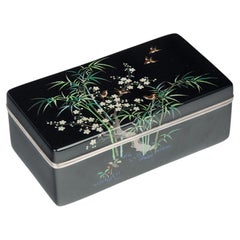 A Meiji period cloisonné box and cover with sparrows, prunus and bamboo