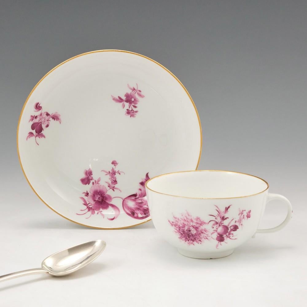 Heading : A Meissen Dot Period tea cup and saucer 
Date : 1763-1774
Period : Frederick Augustus III
Marks : underglaze blue crossed swords interspaced with a single dot.
Origin : Meissen, Saxony, Germany
Colour : Puce with gilt rims
Pattern :