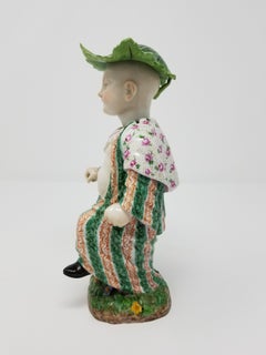 Meissen Porcelain Articulated Nodding Figure of Chinese Boy with Cabbage Hat