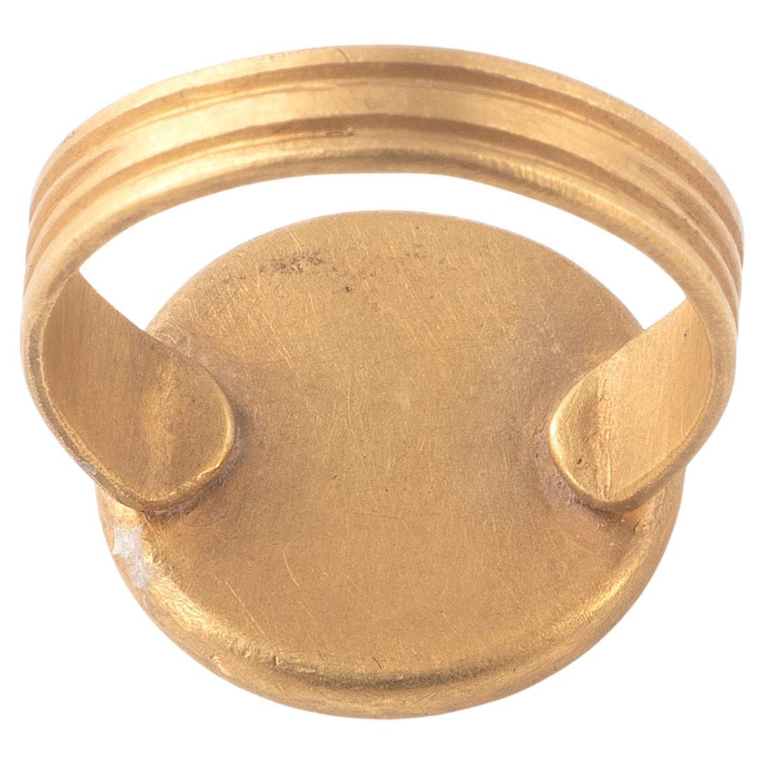 A Merovingian high karat Gold Ring 6Th/ 7Th Century, set with foiled blue and red glass.
Top size:16mm 
Weight: 5.96gr
Size: 6
