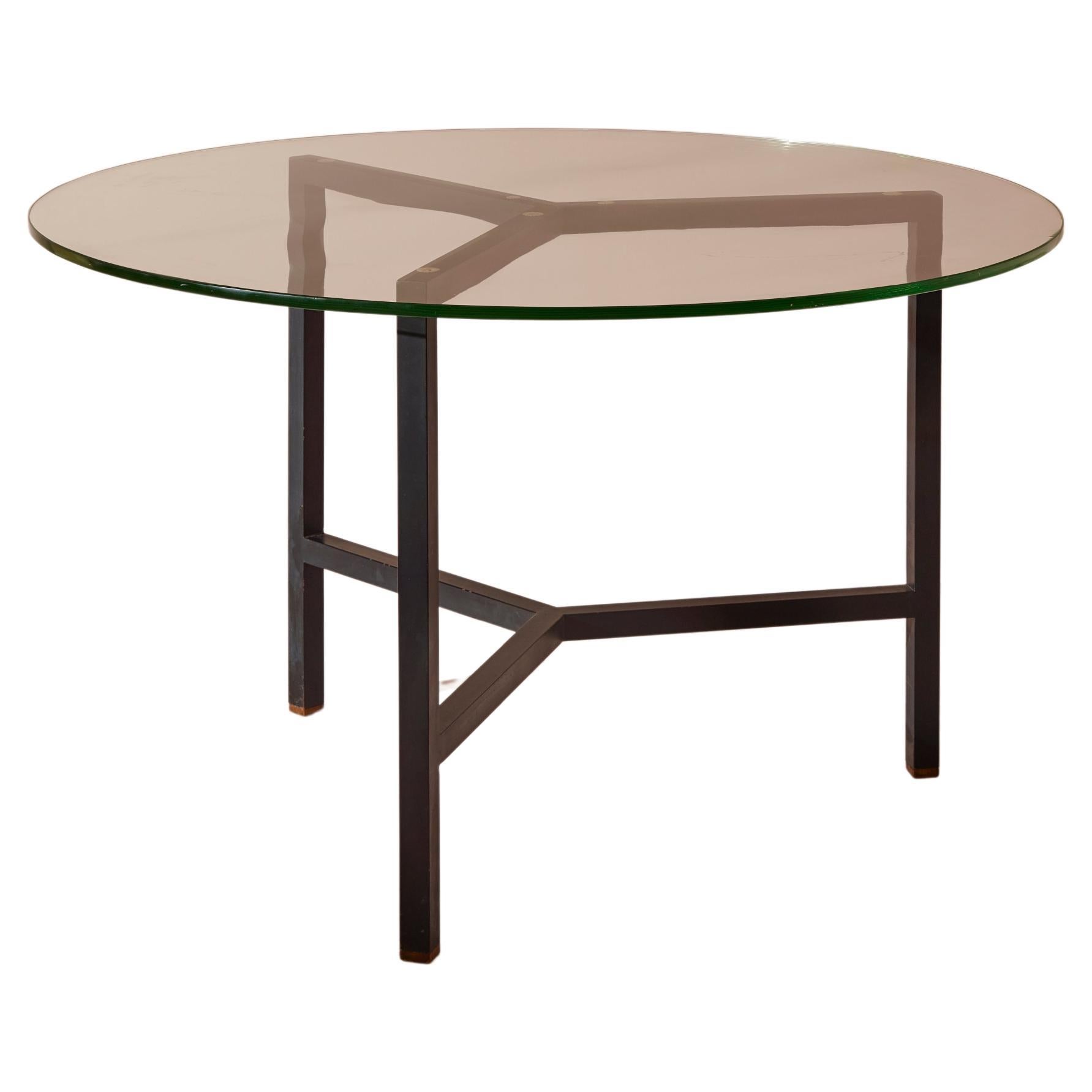 A metal and glass round dining table, Italy, 1950s For Sale