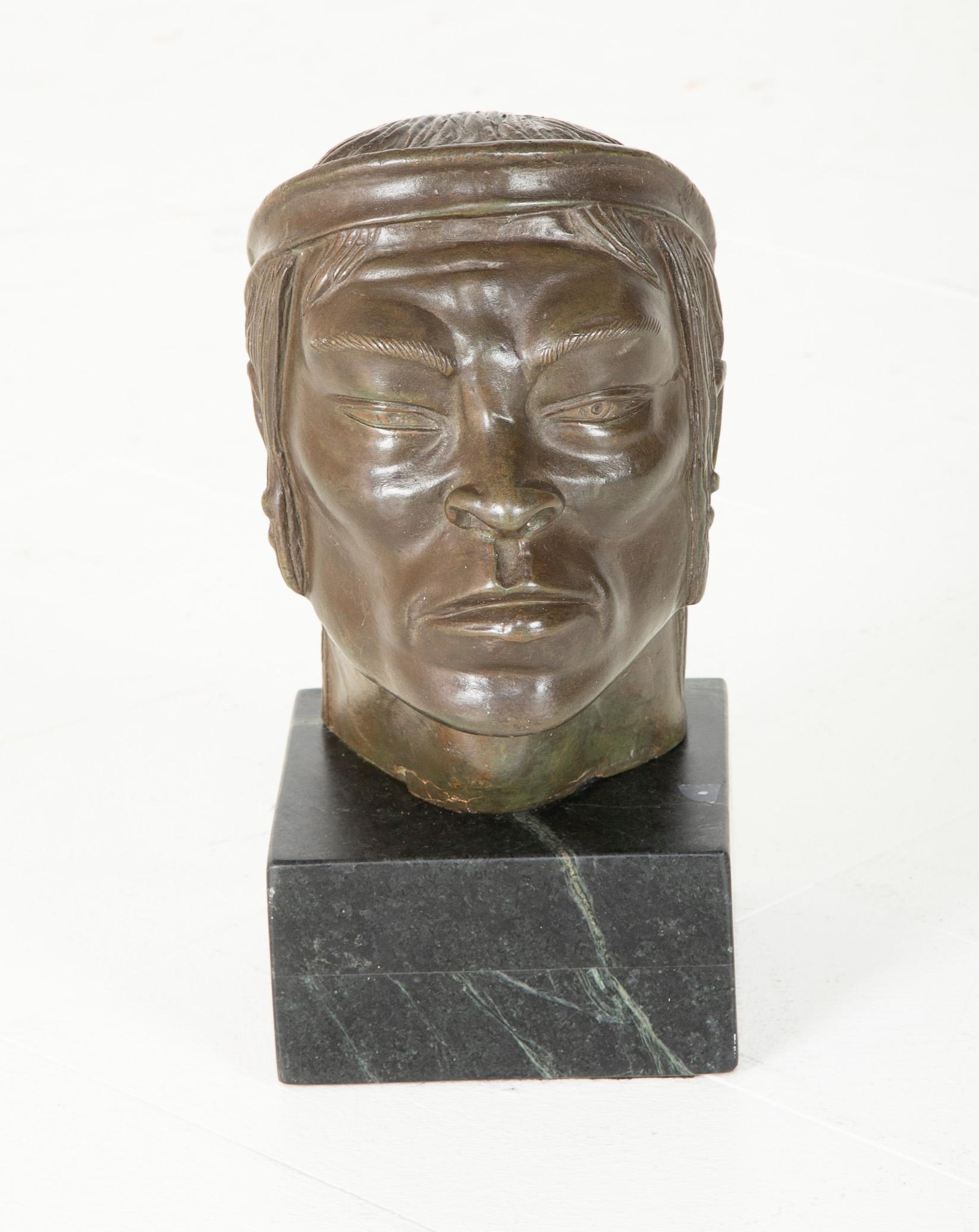 A Bust of a young Mexican Man. Unmarked on marble base.