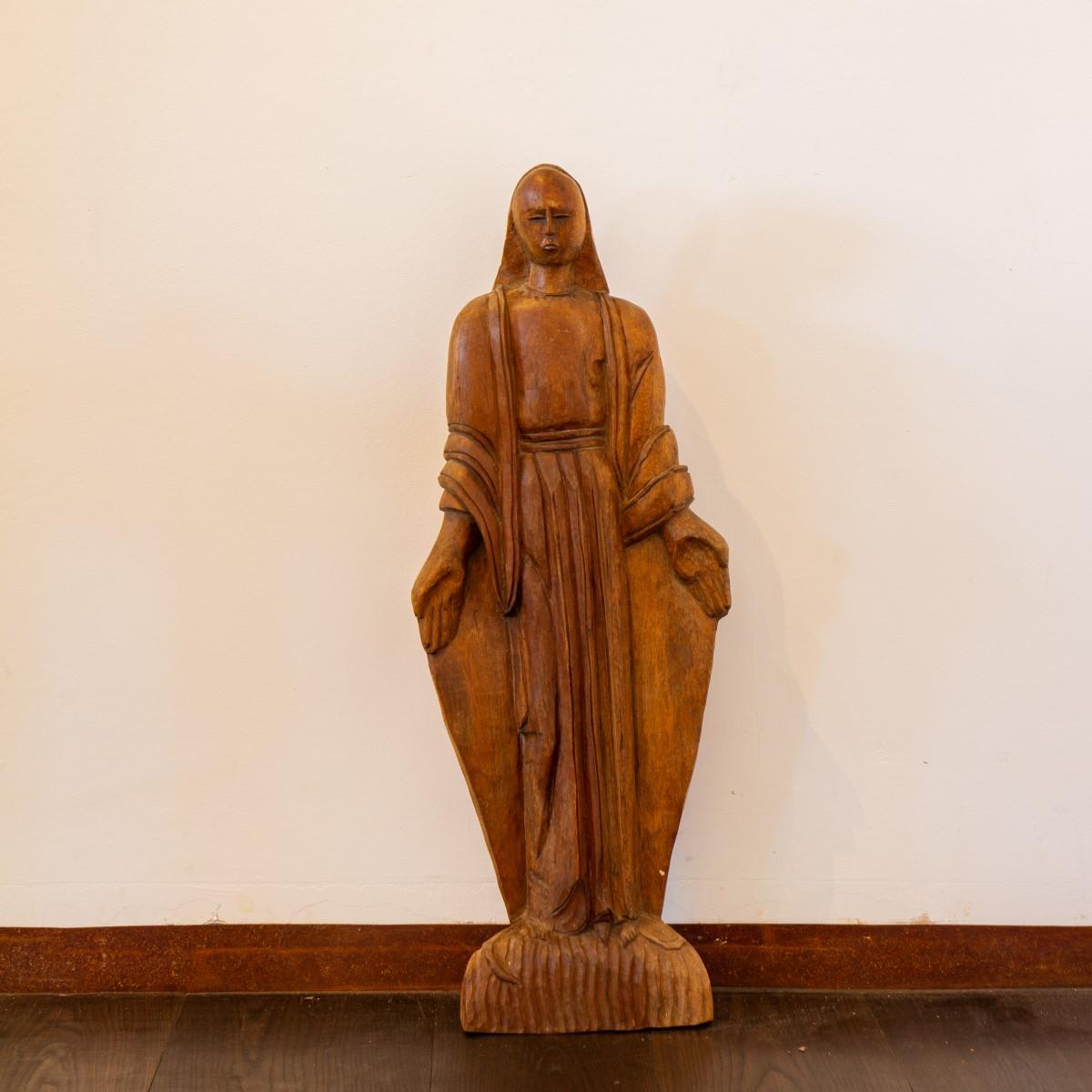 A Mexican carved walnut figure of an evangelical woman, circa 1920s.