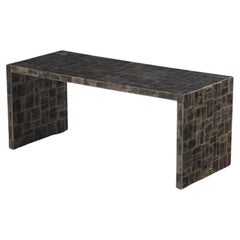 A mica covered coffee table in the manner of Jean-Michel Frank.