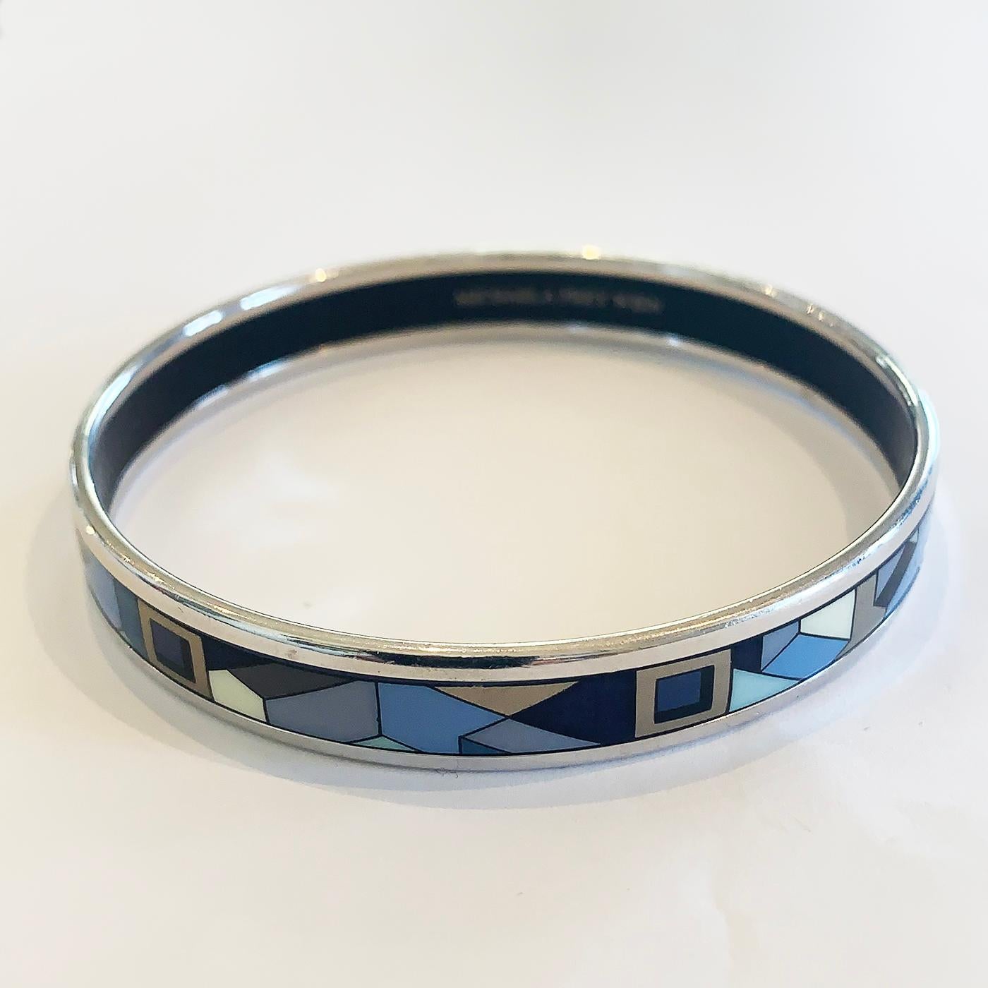 Rare Michaela Frey Bangle in polychrome colour Enamels in the Cloisonné Style. Intricate Geometric design in blue, black and multi coloured metallic finishes. Originally manufacturer based in Vienna, Austria founded in 1951. Totally perfect with no