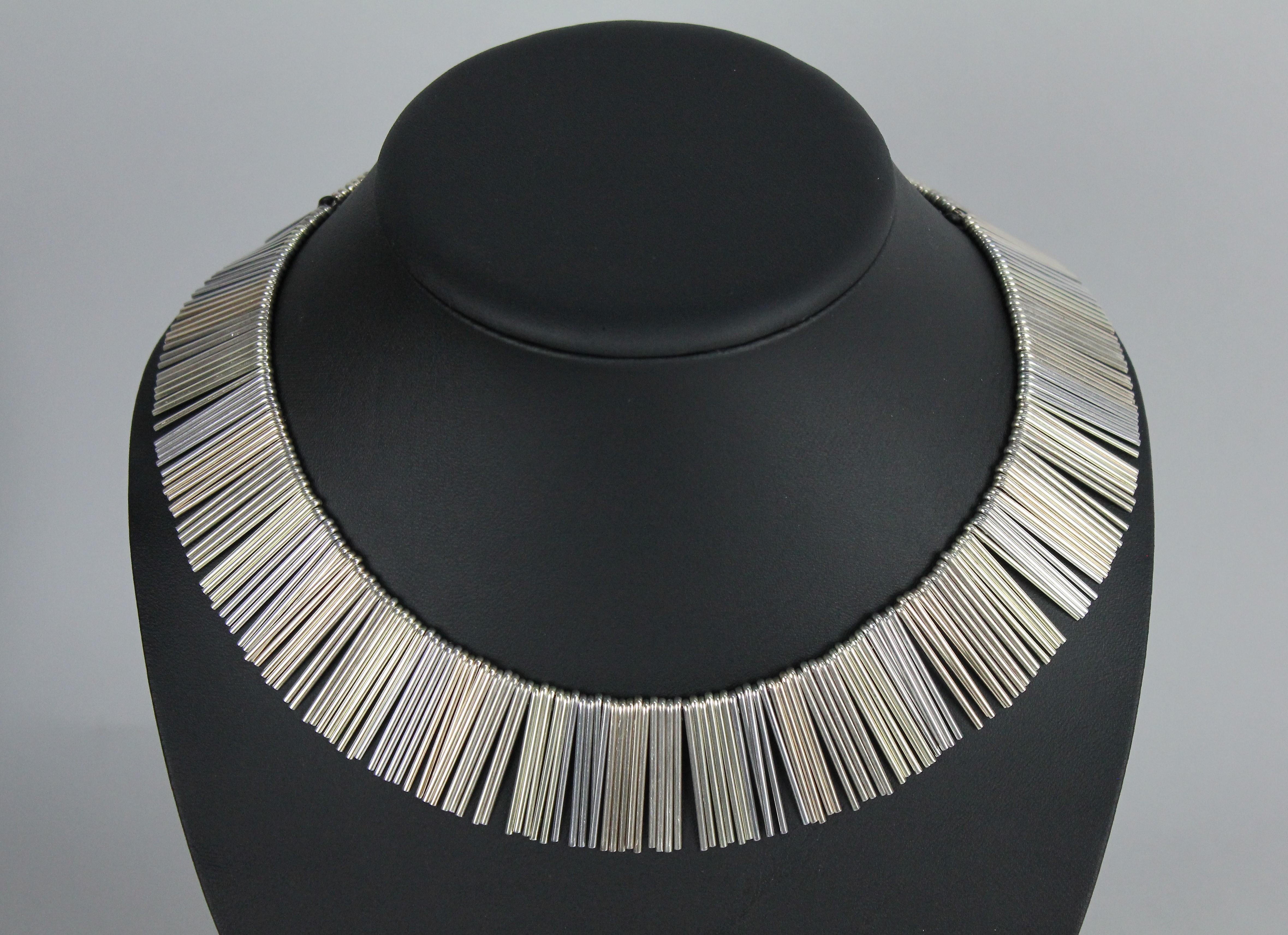 A. Michelsen Denmark, Scandinavian modern necklace. With three colored silver.

Amazing necklace made of three colored silver, silver, gilt silver, and oxidized silver.
Very stylish! Really good vintage condition.

A. Michelsen was a leading Danish