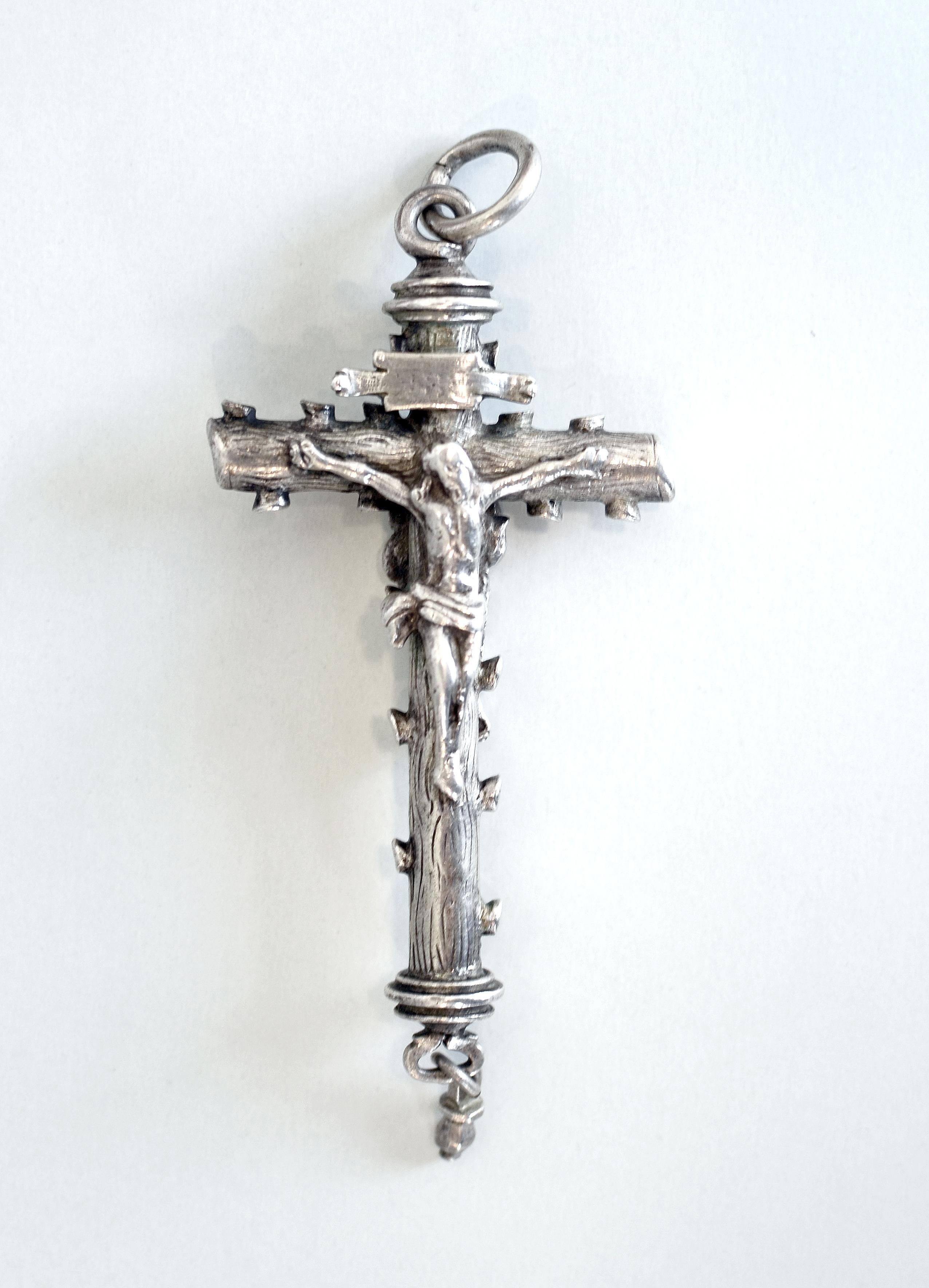 A mid-17th century silver crucifix devotional pendant

Anonymous
Mid-17th century; probably Spain
Silver

Approximate size: 11 x 4.8 cm
Weight: 40.2 grams

The present crucifix is of the 17th century, probably Spanish in origin, and was likely once