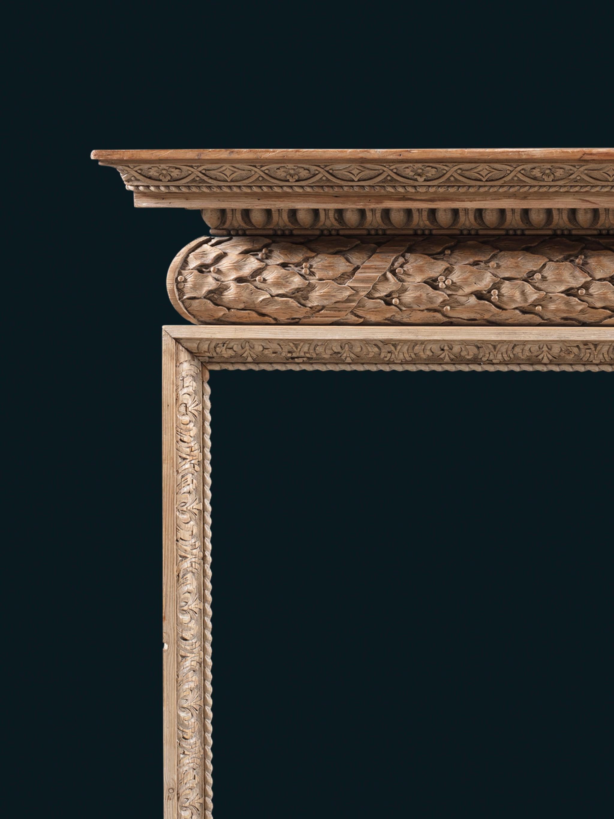 The moulded shelf richly carved with egg and dart, above a barrel frieze carved with running laurel bound in ribbon, unusually running left–to–right rather than symmetrically from the centre.

Dimensions
Height 50⅛in (127.5cm) width 53¼in