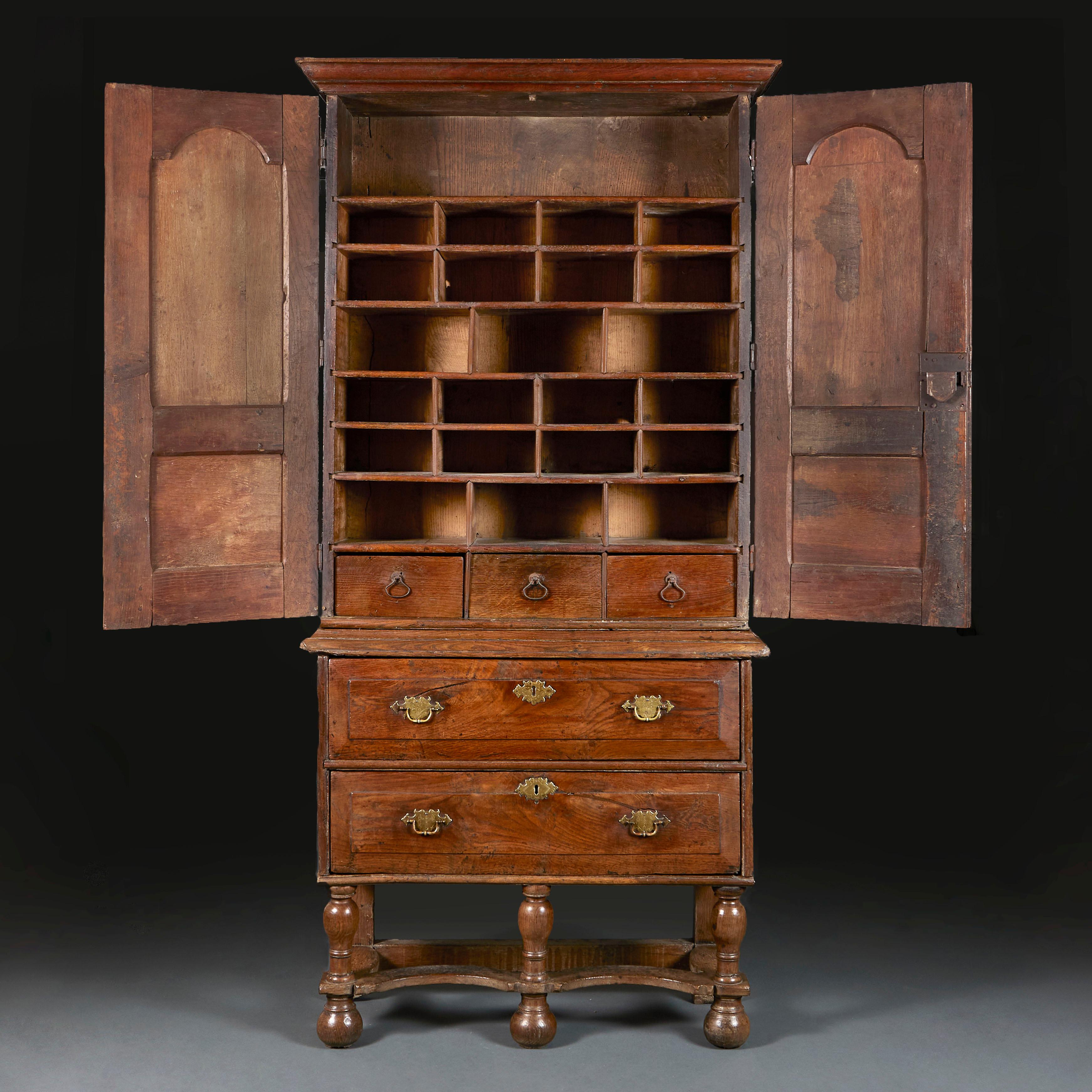 English A Mid 18th Century Elm Cabinet on Stand  For Sale