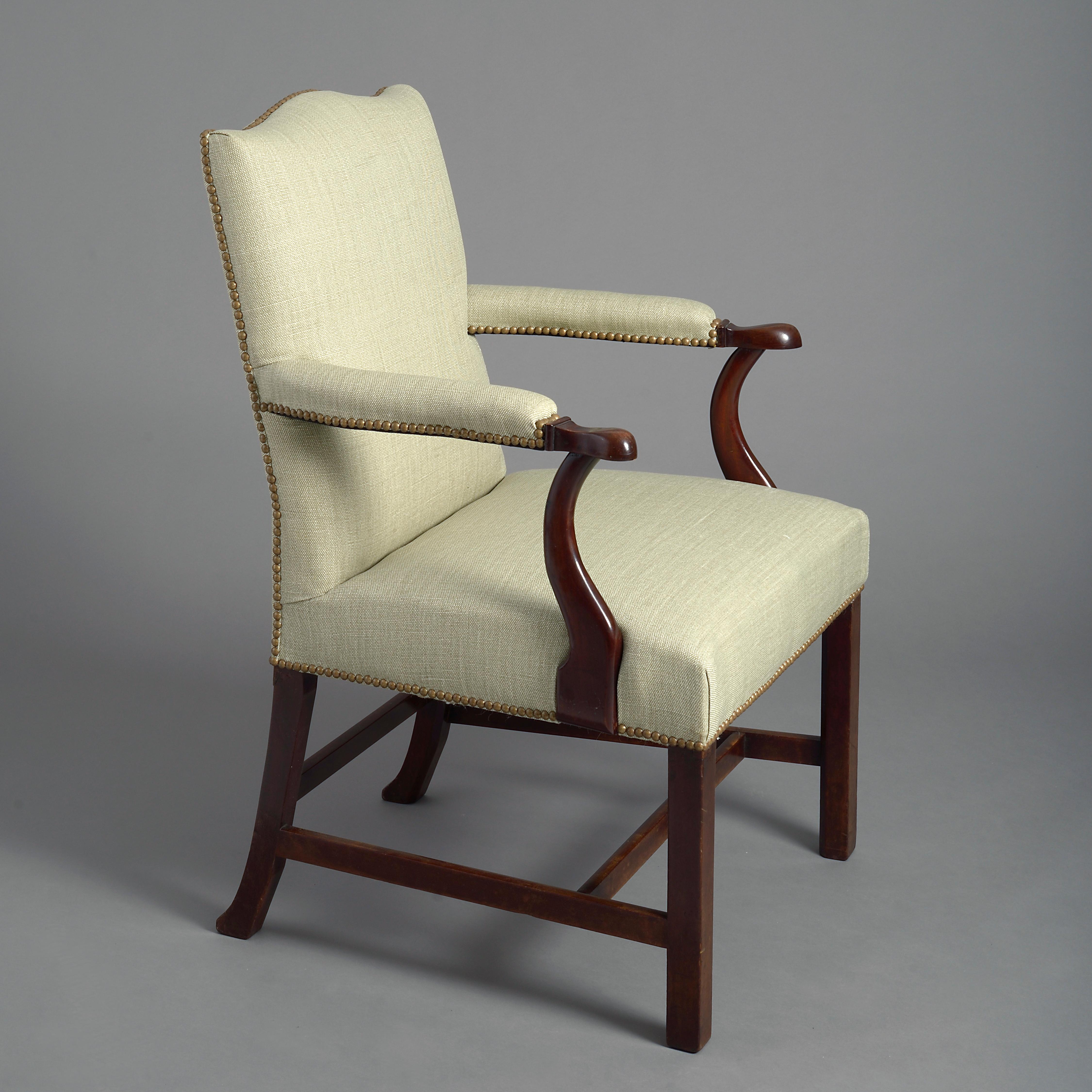 A mid-18th century George III Period Gainsborough armchair, the upholstered back having a serpentine crest rail, the mahogany arms with over-stuffed pads upon an upholstered seat, terminating in square block legs with H-form stretchers.