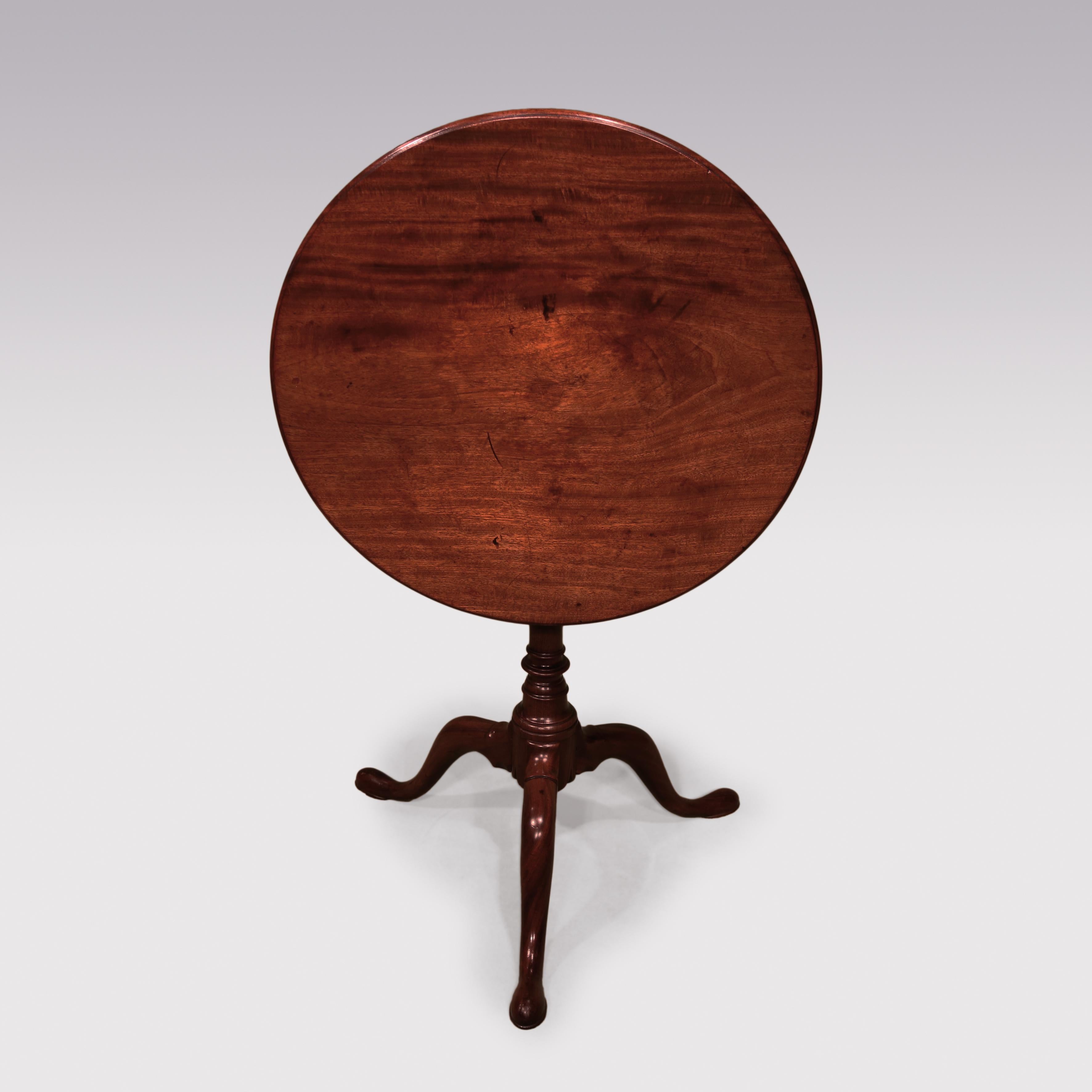 A George II period figured mahogany birdcage-action tripod table, having moulded edged circular top raised on baluster turned stem ending on well-shaped legs with pad feet.