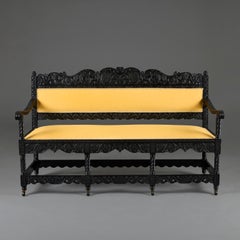 A Mid-19th Century Anglo-Indian Carved Ebonised Sofa