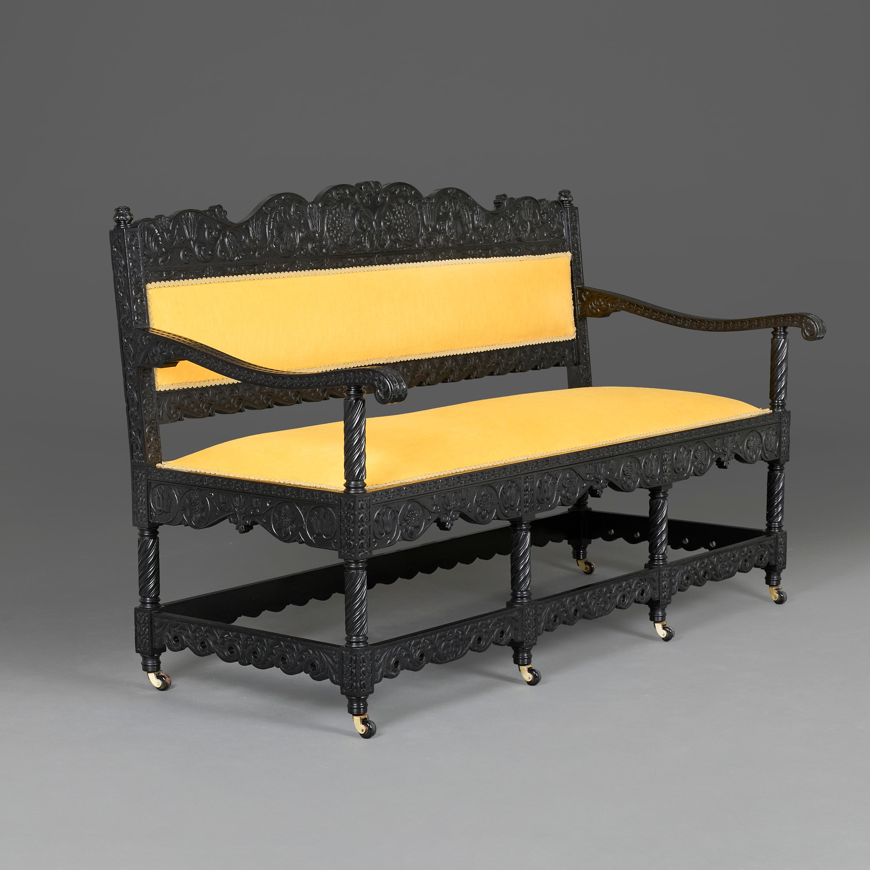 A Mid-19th Century Anglo-Indian Carved Ebonised Sofa (Indisch) im Angebot