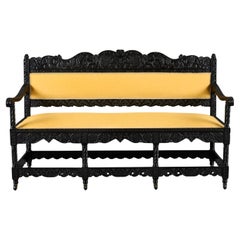A Mid-19th Century Anglo-Indian Carved Ebonised Sofa