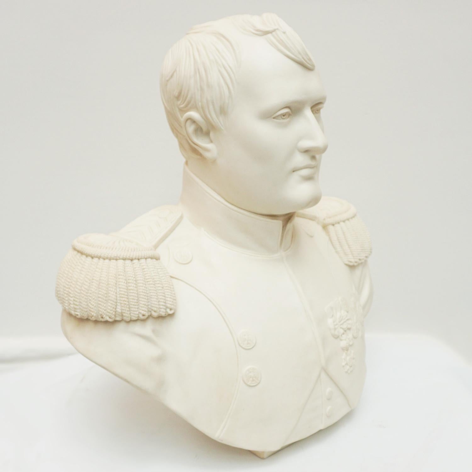 A Mid 19th Century life size biscuit porcelain portrait bust of Napoleon Bonaparte in military attire after Jean-Antoin Houdon. Etched ' Buste Officiel Napoleon Empereur 1805' to back.

Dimensions: H 52cm W 48cm D 24cm

Origin: French

Date:
