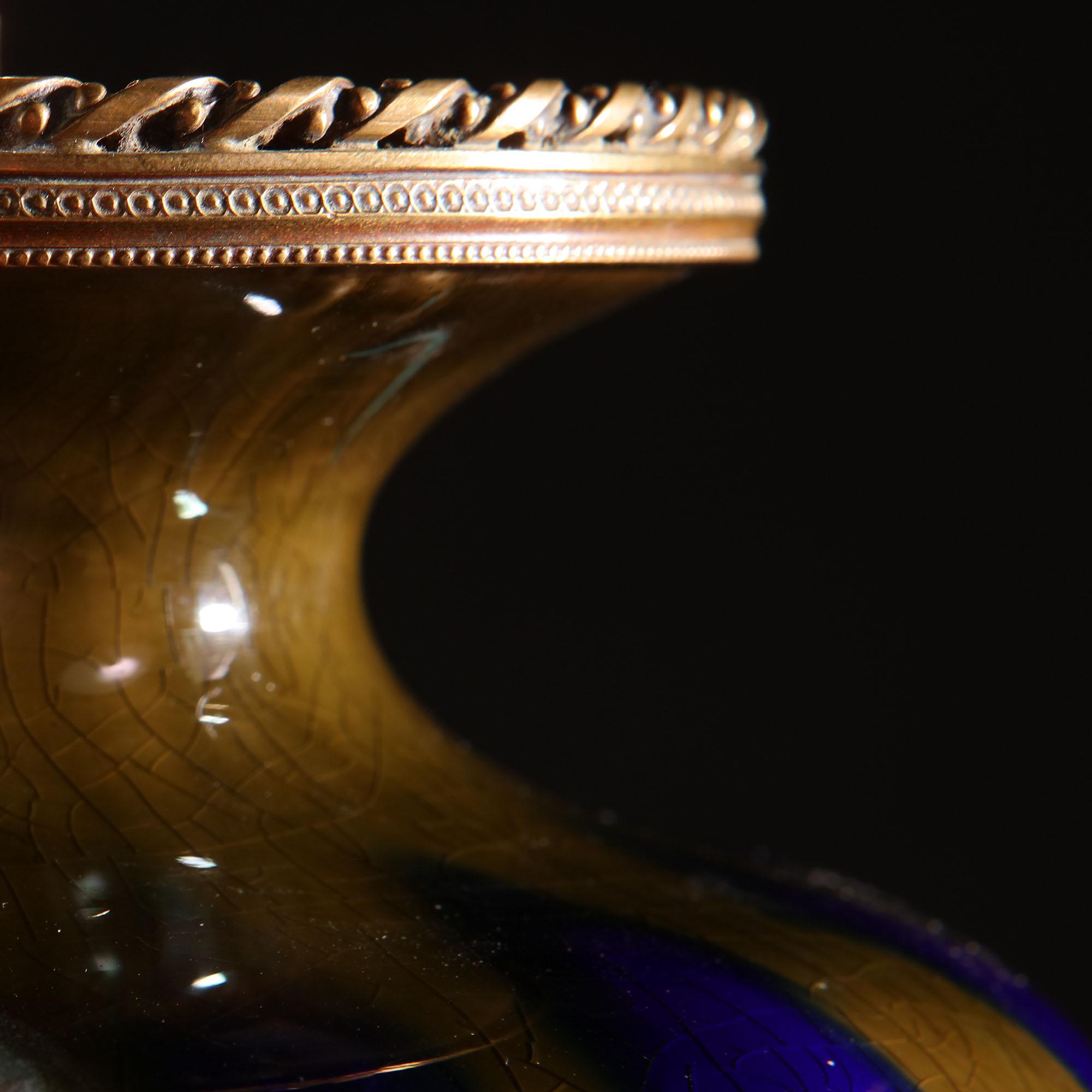 A mid-19th century French blue flambé vase with ormolu mounts, now mounted as a lamp.

Please note: Lampshade not included.

Currently wired for the UK. Please enquire for rewiring services.