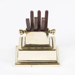 A mid 19th century brass and steel knife sharper.