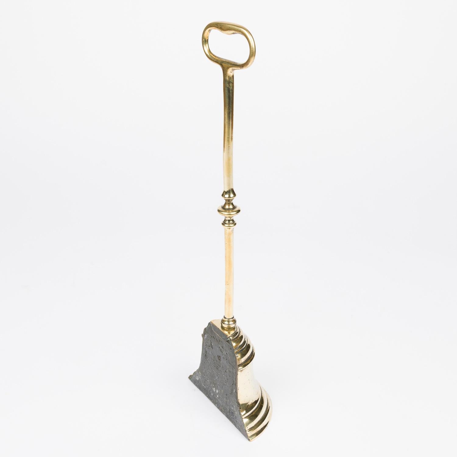 Brass A mid 19th century brass bell shaped door stop For Sale