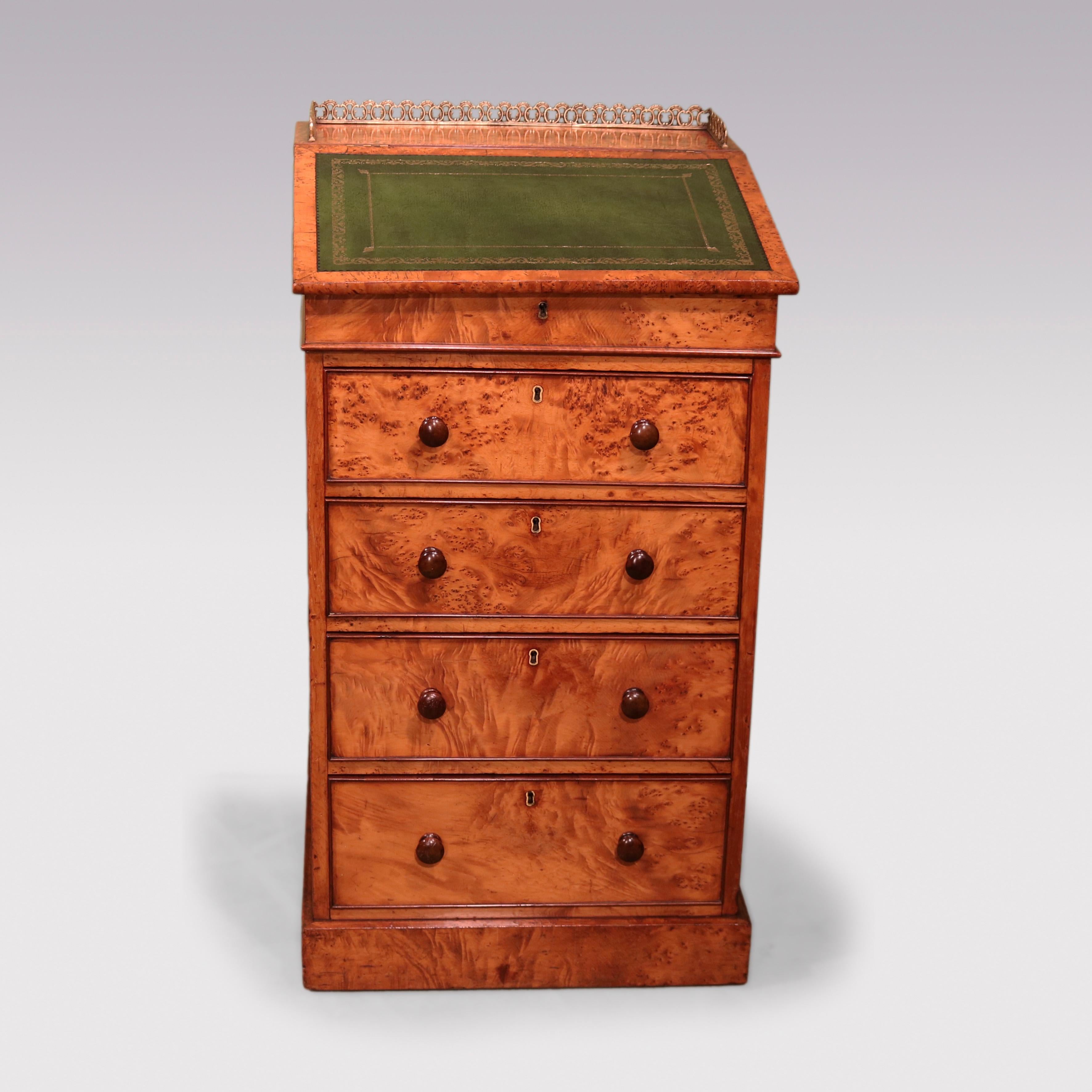 A fine quality mid-19th century burr elm Davenport, having brass gallery & gilt-tooled green leather swivel lift-up top enclosing small drawers, above 4 mahogany & cedar lined graduated drawers ending on plinth base. Stamped C. Hindley and Sons Late