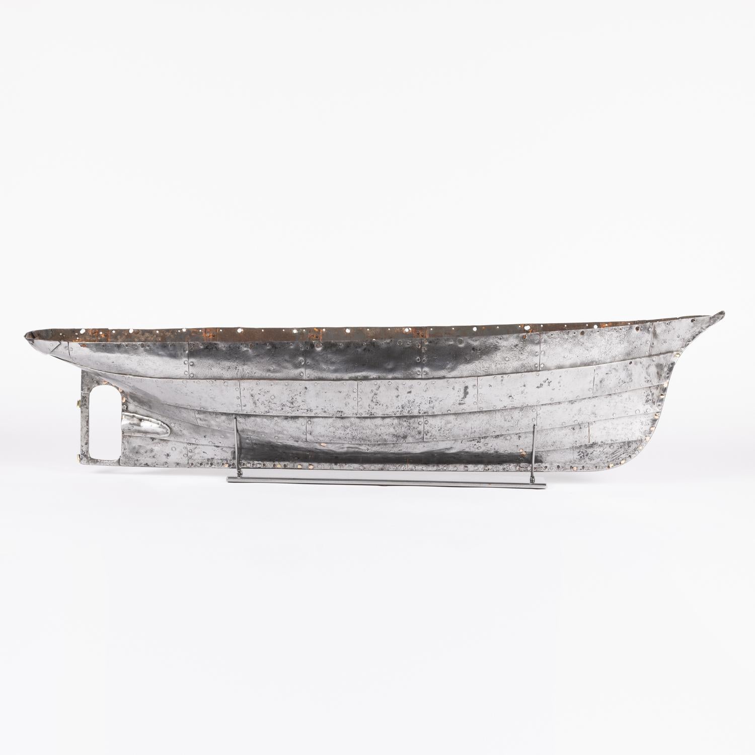 A mid 19th century riveted steel plate hull of a model steam yacht. 4