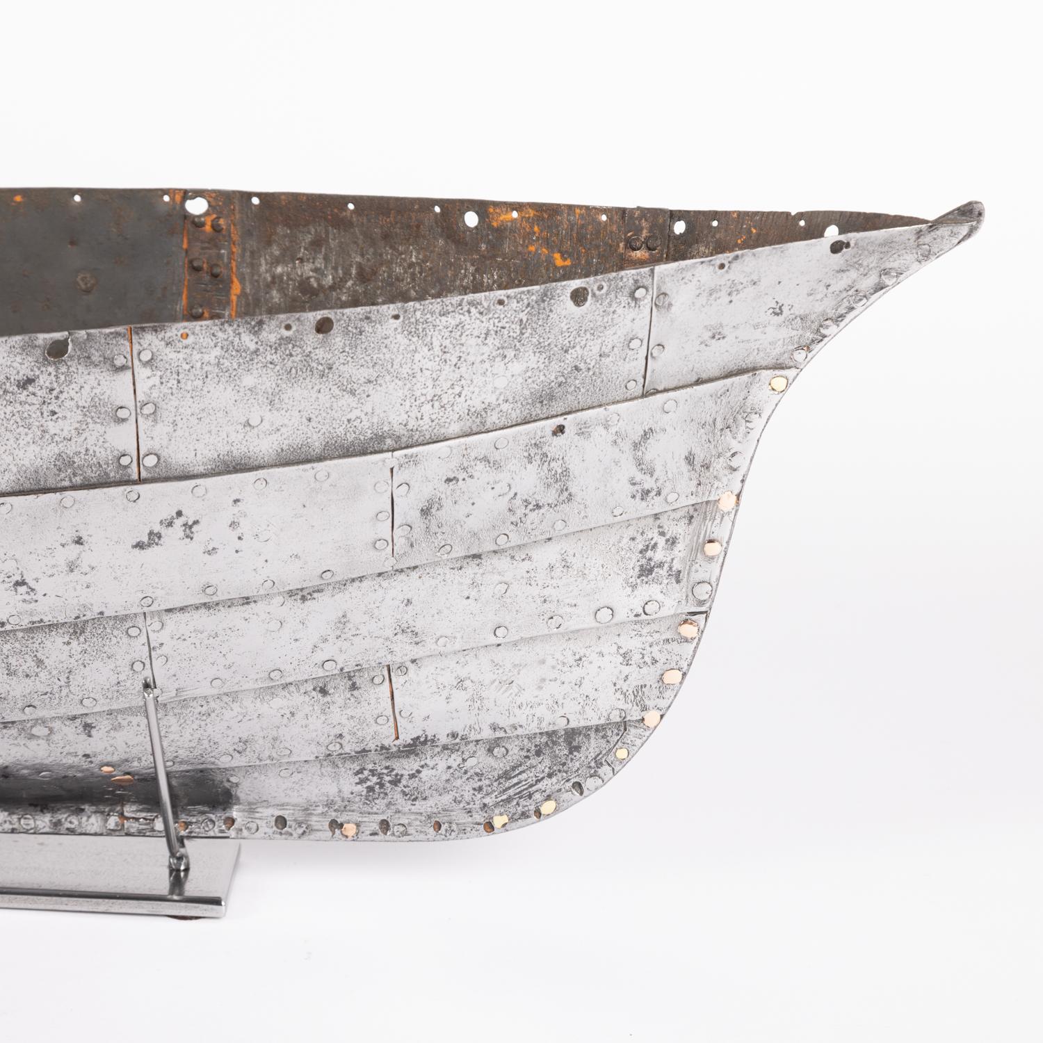 19th Century A mid 19th century riveted steel plate hull of a model steam yacht.