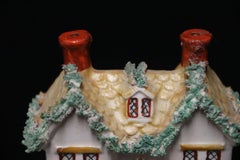 A mid 19th century Staffordshire pottery cottage money box, Circa 1840 English