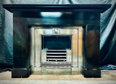 A Mid 19th Century Victorian Scottish Belgian Black Marble Fireplace Surround.