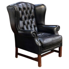 Large English Wing Back Chair of Black Leather in the George III Style