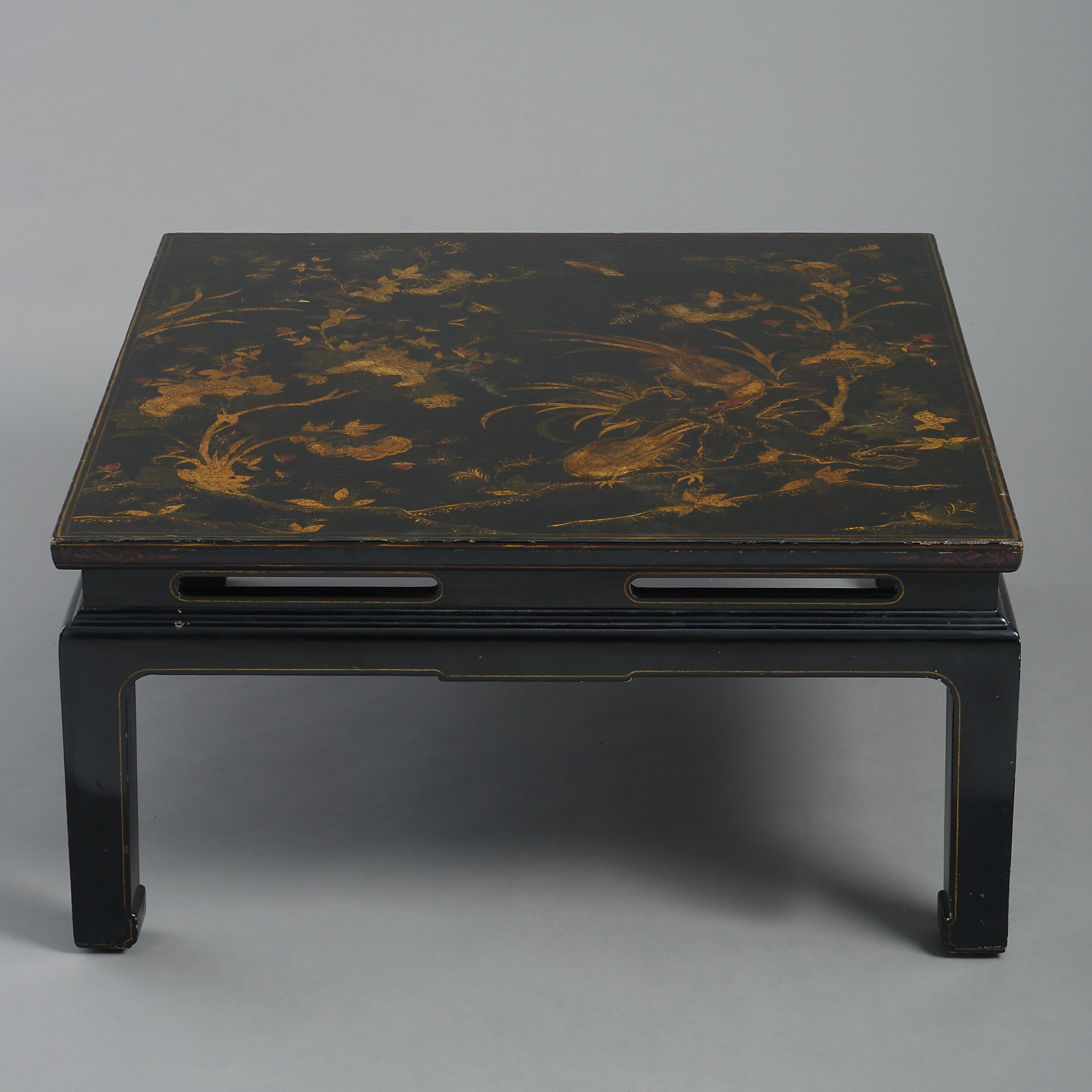 A mid-20th century black and gold japanned chinoiserie low table, the top of square form and profusely decorated with exotic birds and flowers, set upon a base, constructed in the Chinese manner.