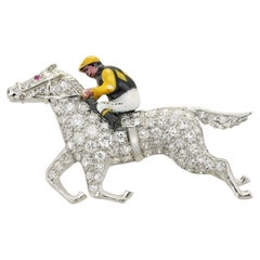 A mid 20th Century diamond and enamel jockey brooch