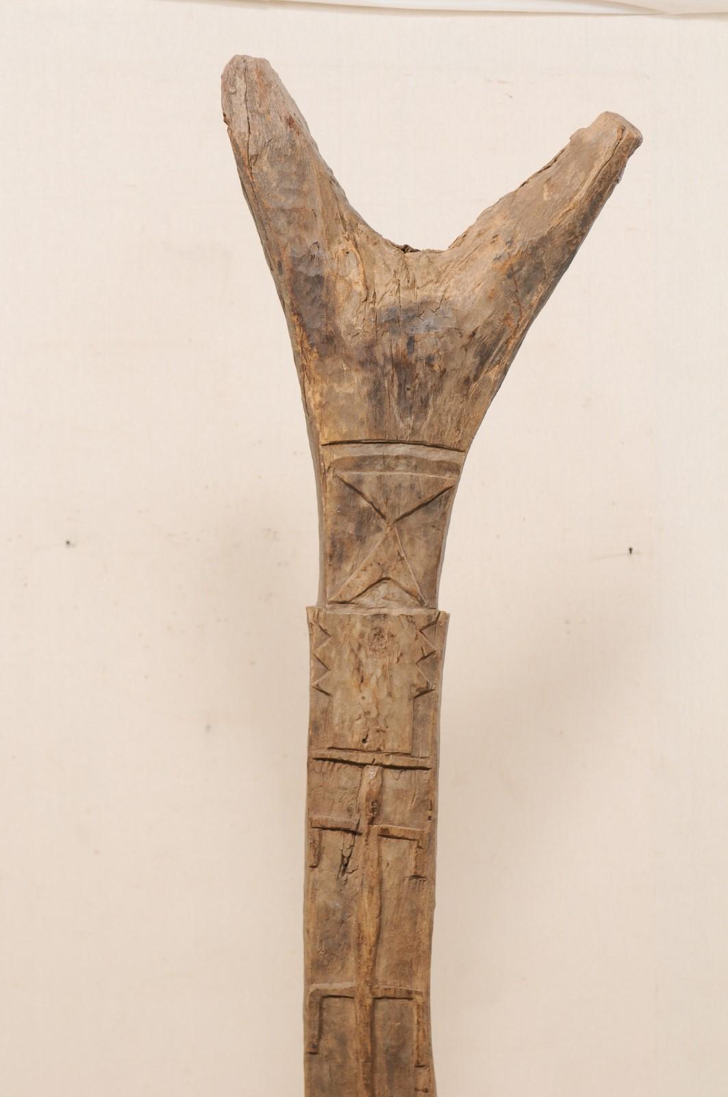 A Dogon Tribe Toguna Post from Mali (Mid 20th C.) on Custom Iron Stand In Good Condition For Sale In Atlanta, GA