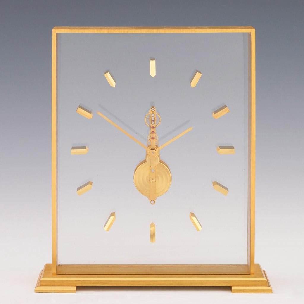 A mid 20th century mantel clock by Jaeger LeCoultre. Gilt brass framed with glass case and clear glass background. Original 8 day movement in full working order with original box. 

Dimensions: H 19.5cm W 17cm D 4.5cm

Origin: Swiss

Date: Circa