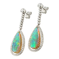 A mid-20th century opal and diamond drop earrings