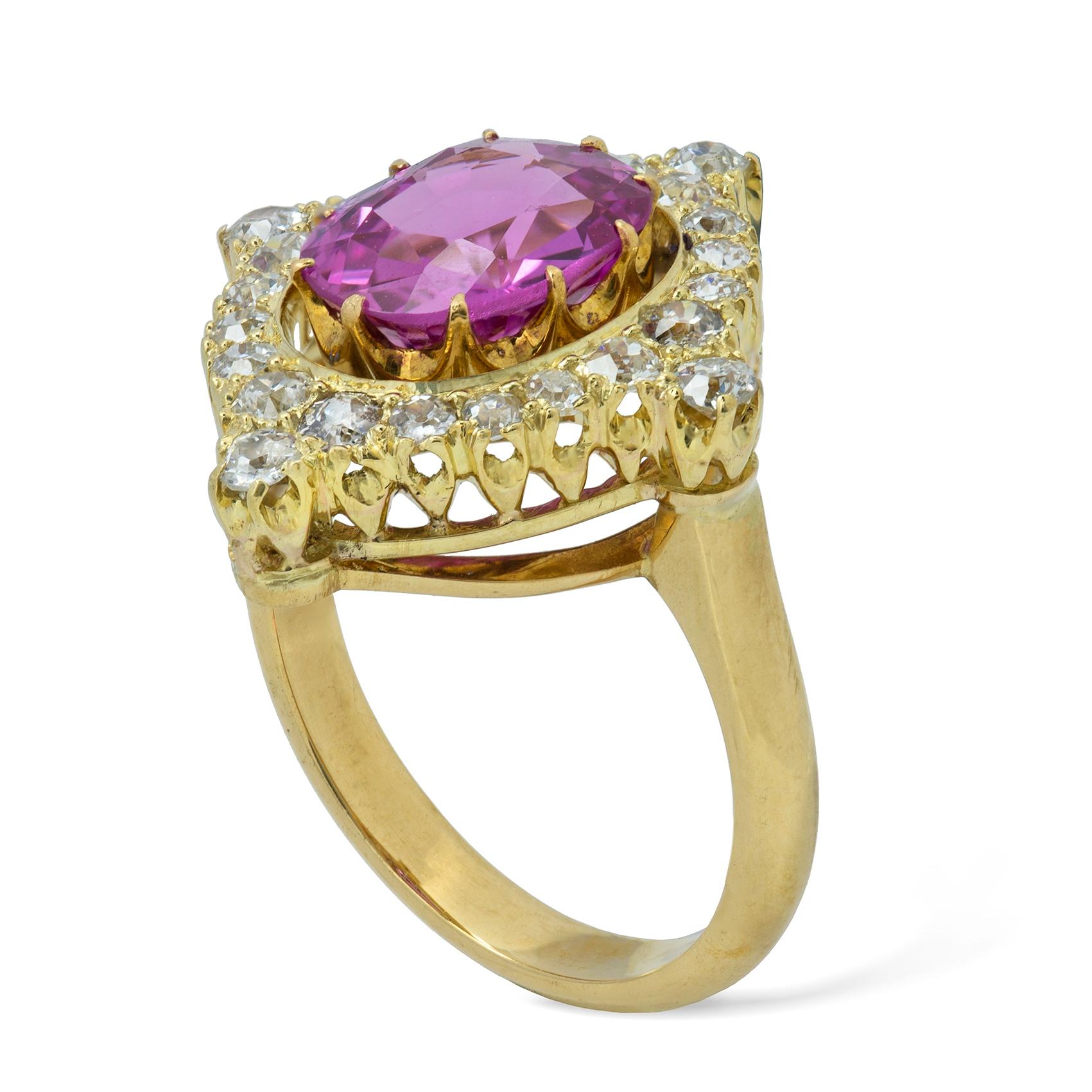 A pink sapphire and diamond ring, the centre set with an oval-cut pink sapphire accompanied by GCS report  stating the sapphire to be natural no heat of Sri Lankan origin, total weight 3.21cts, set in ten claws in yellow gold surrounded by a border