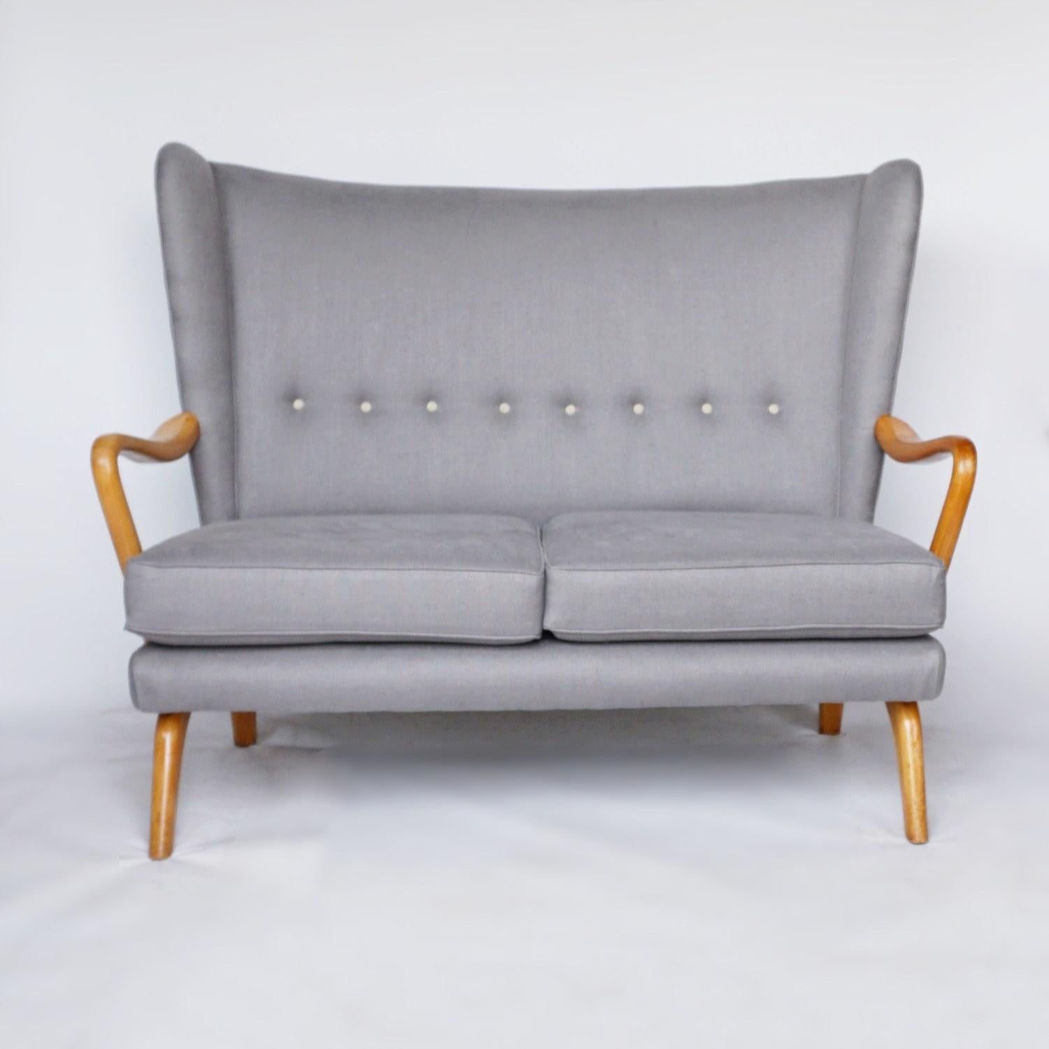 A bambino two seat sofa by Howard Keith for H.K Furniture. Solid beech arms and legs, re-upholstered in dark grey linen. 

Dimensions: H 98cm W126cm D 65cm Seat H 41cm W 110cm D 52cm 

Origin: English

Date: Circa 1950

Item Number: