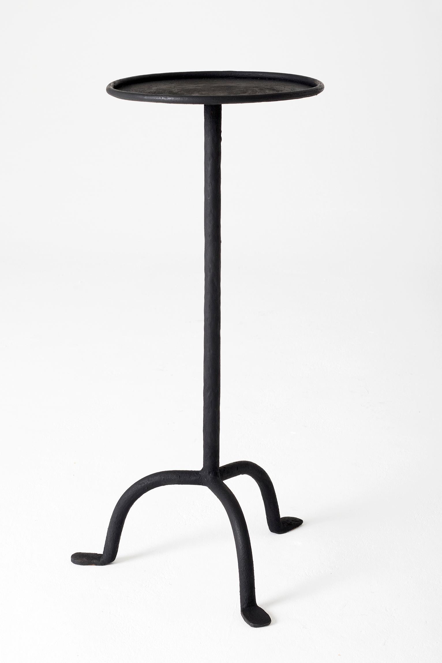 A black patinated wrought iron martini table
Spain, second half of the 20th century.
 